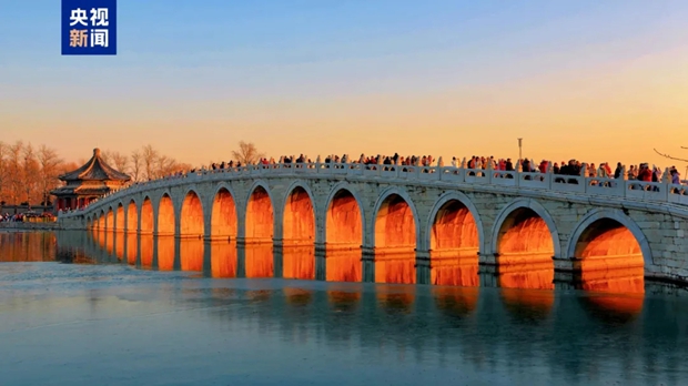 Golden sunlight streams through arches of Beijing